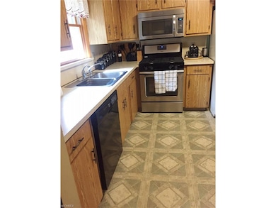 A view of the kitchen from the dining room door.  
