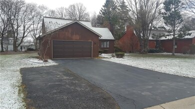 Front of house - driveway is double wide plus