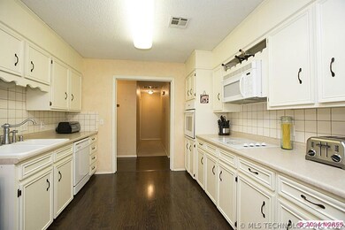Bright Kitchen features new wood floors, new built