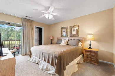 Bedroom featuring light carpet, access to outside, and a ceiling fan