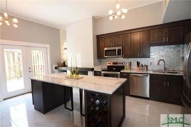 kitchen with marble top island and marble counters