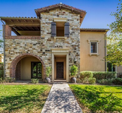 Stone clad front entry facing a park