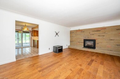 The 18x13 Living Rm with Electric Fireplace, can b