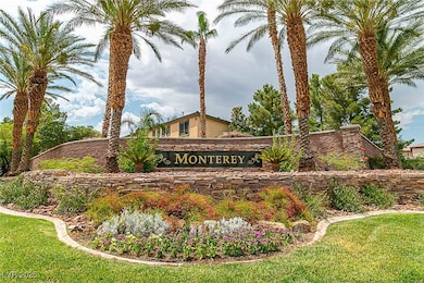 Community / neighborhood sign featuring a yard