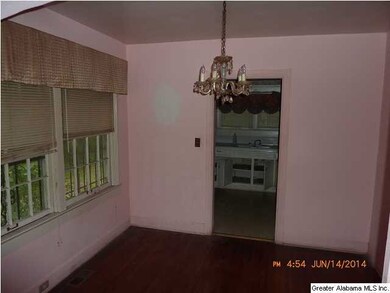 Dining Room with Hardwood Floors and Crystal Chand