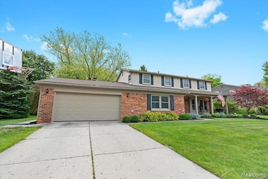 Attached 2 Car Garage (extra large bonus space area for lawn equipment)