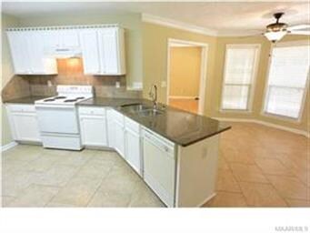 THE KITCHEN HAS NEW GRANITE COUNTER TOPS, TILE FLO