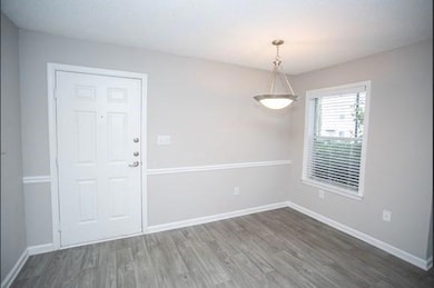 Unfurnished room with hardwood / wood-style floori