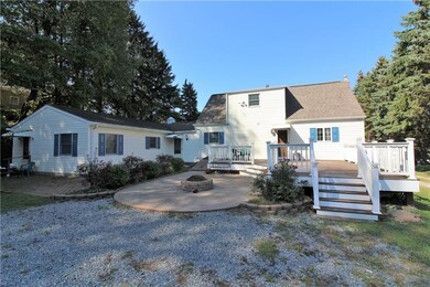 Rear view.  Large rear deck.  Fire pit.  Separate 