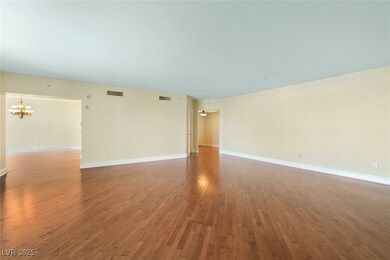 Unfurnished room with a chandelier, hardwood / woo