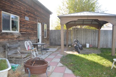 View of patio / terrace featuring a gazebo and an outdoor fire pit