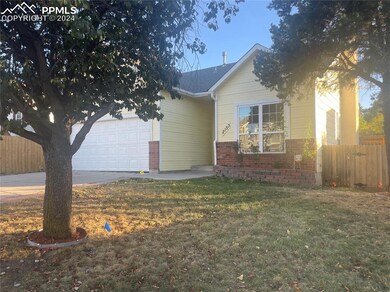 View of front of property with a front yard and a 