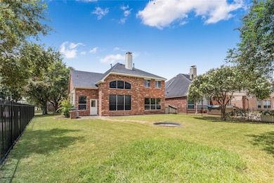 This is a two-story brick home featuring a spaciou