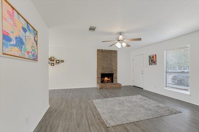 Unfurnished living room with wood finished floors