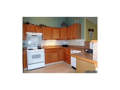 Kitchen with Tile Flooring and all appliances stay