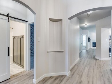 Hallway featuring light hardwood / wood-style floo