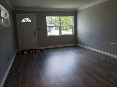 Living room with new windows and front door