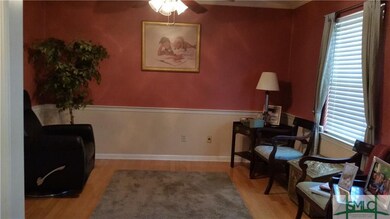 Formal dining room used as reading room.  Hard Woo