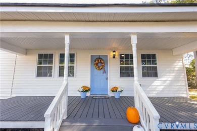 Property entrance featuring covered porch