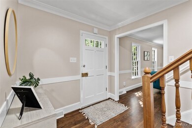 Wood floored foyer with a wealth of natural light