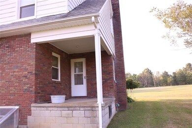 11x8 concrete & brick side porch with access from 