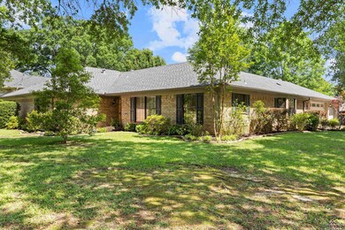 Ranch-style house featuring a front yard, brick si