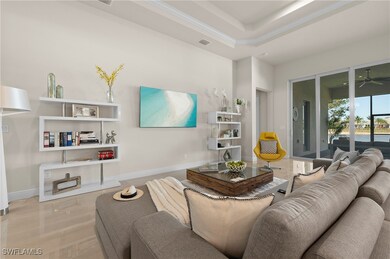 Living area featuring crown molding, recessed ligh