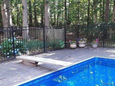View of pool featuring fence and a patio