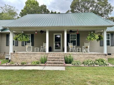 Immaculate landscaping, double ceiling fans, and a beautiful view off this front porch!!