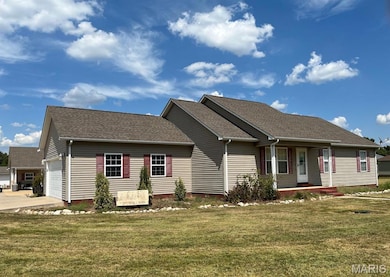 Single story home with a shingled roof, a front yard, a garage, a porch, and concrete driveway