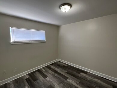 Spare room featuring dark hardwood / wood-style floors