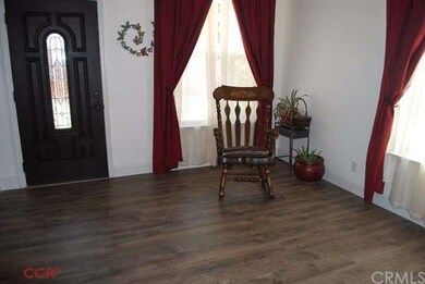 Living room with new grey oak laminate floors and 