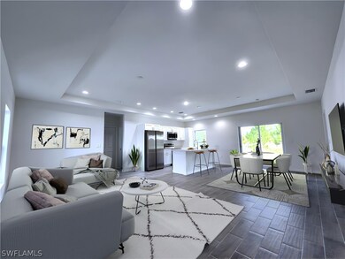 Living room with wood-type flooring, sink, and a r