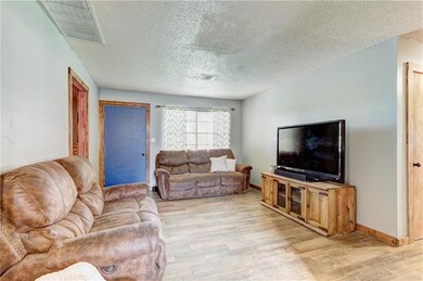 Living room with fresh paint and updated wood-grai