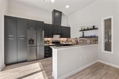 Kitchen featuring stainless steel appliances, dar