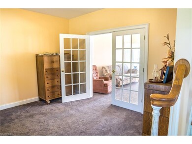 French doors between Living and Family Rooms. Carp