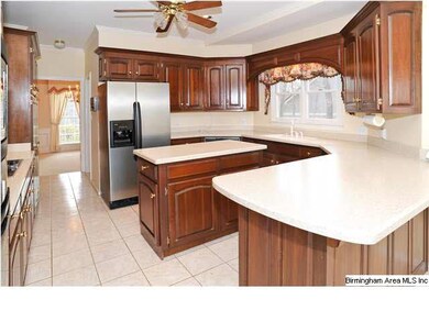 Large kitchen with cherry cabinets, island and sol