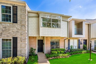 This charming townhouse features a classic brick e