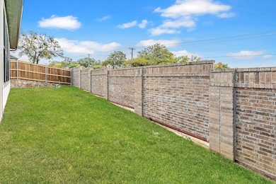 View of fenced backyard
