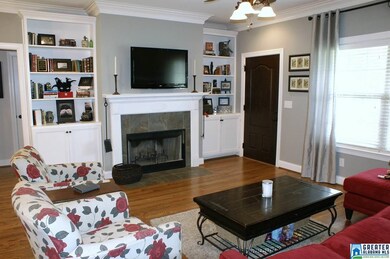 Hardwood floors, bookcases, Wood burning fireplace