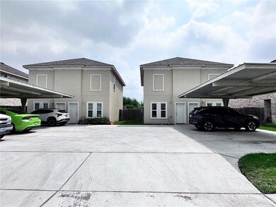 View of side of property featuring covered parking, stucco siding, fence, and roof with shingles