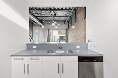 Kitchen with a peninsula, dishwasher, tasteful ba