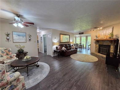 Living room featuring wood finished floors, a ceil
