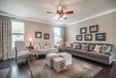 The natural light especially highlights the soothing paint colors, crown molding, and hardwoods!