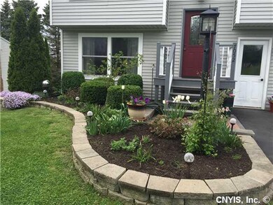 Exterior Front. Beautifully landscaped, newer viny