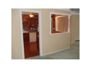 KITCHEN IS CONVENIENTLY LOCATED BETWEEN THE DINING