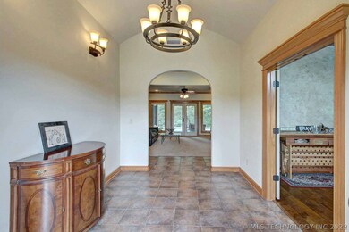 Stunning entry with elegant lighting, high ceiling