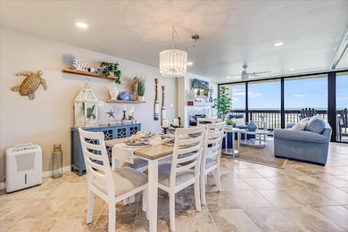 The dining area is located between the kitchen and