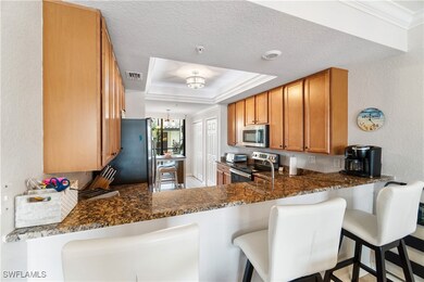Kitchen with stainless steel appliances, a tray ce