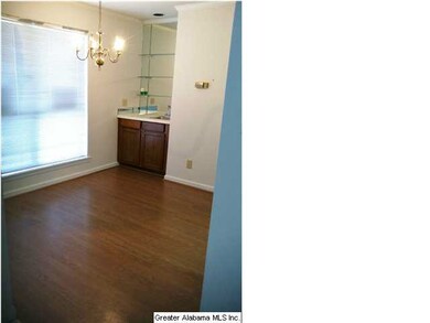 Hardwoods in dining room with wet bar.